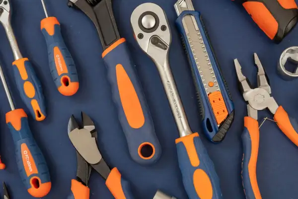 tools-with-orange-and-blue-handles-on-blue-2026-03-16-00-52-13-utc-optimised tools-with-orange-and-blue-handles-on-blue-2026-03-16-00-52-13-utc-optimised